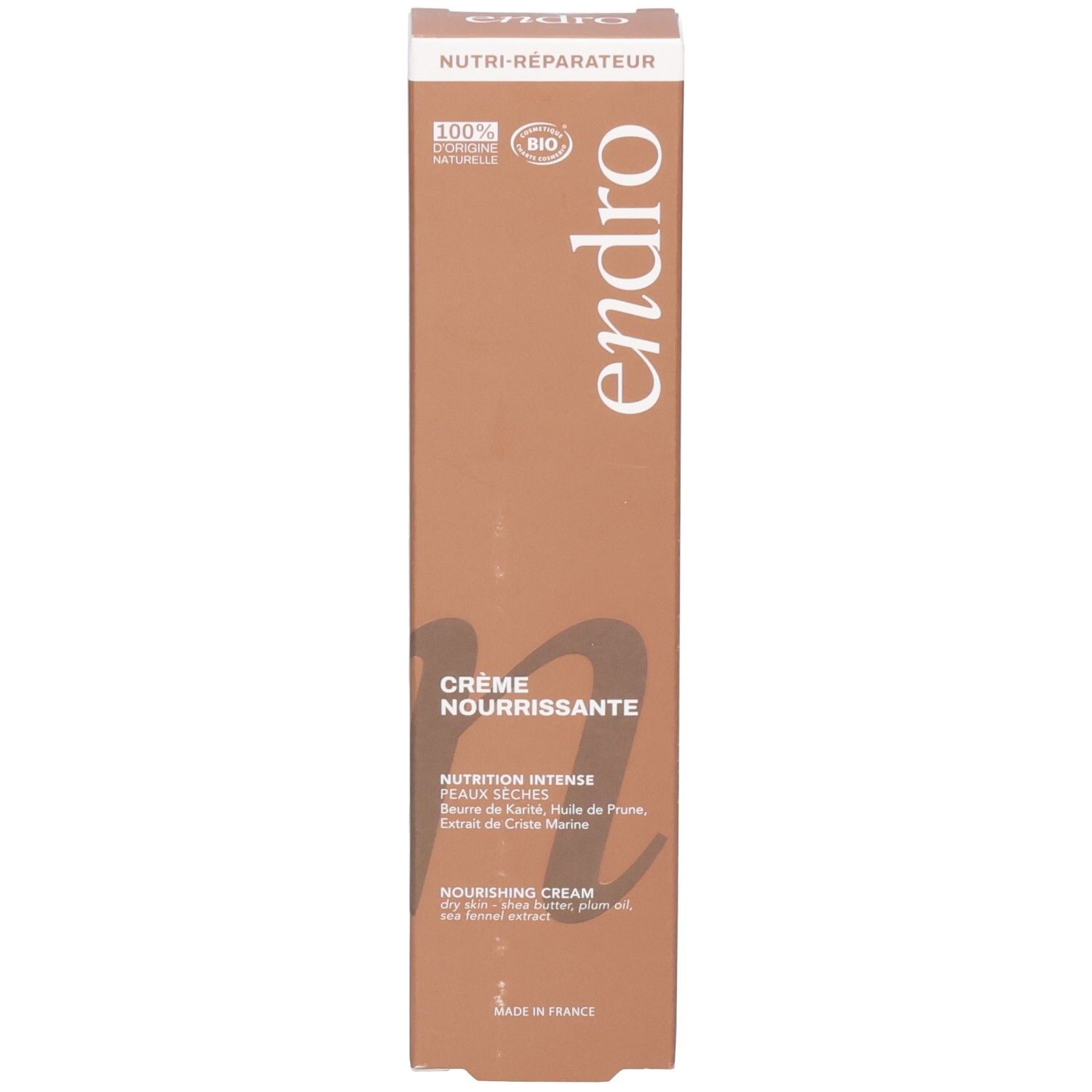 Vista laterale della scatola di crema viso nutriente Endro. Marrone con scritte bianche.