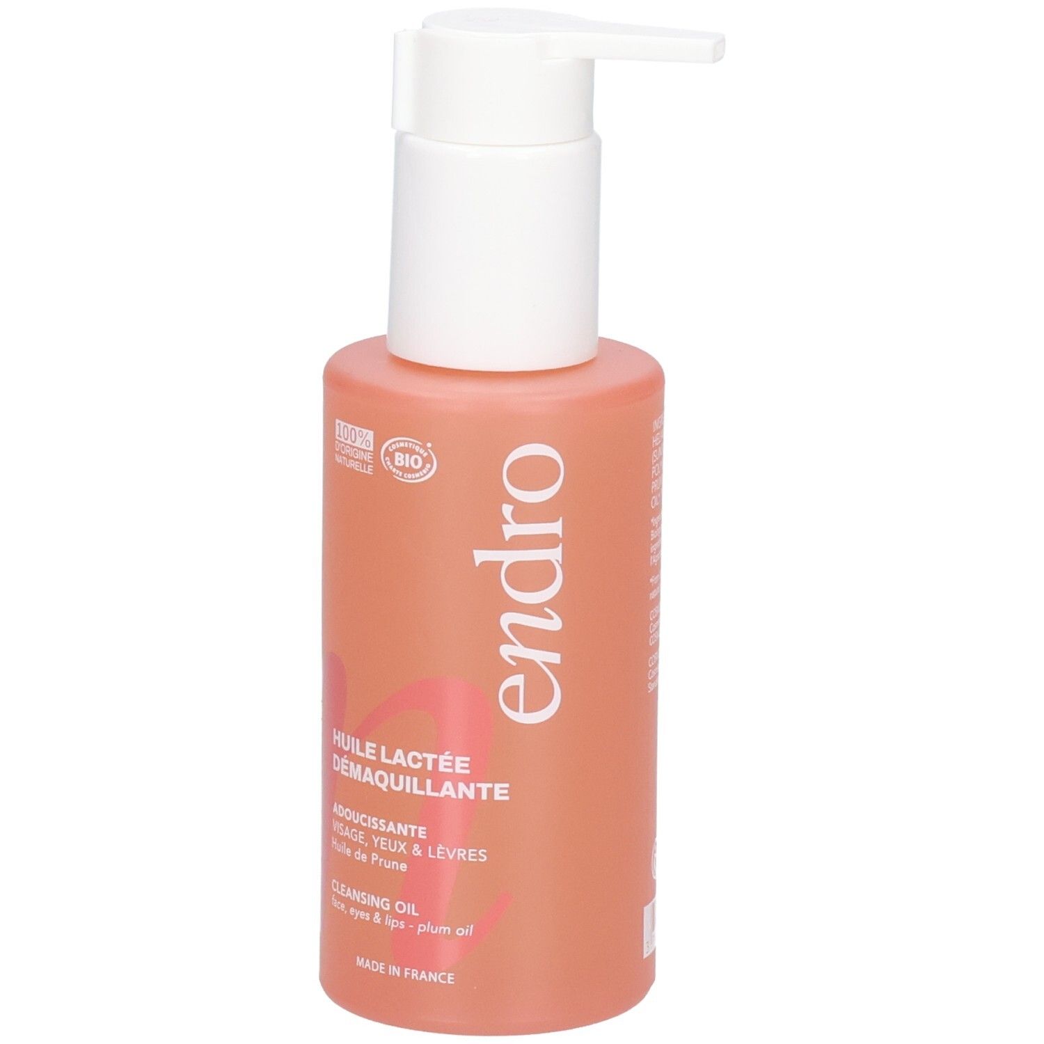 Flacone di olio struccante Endro con erogatore a pompa. Flacone color corallo con etichetta bianca e scritte.