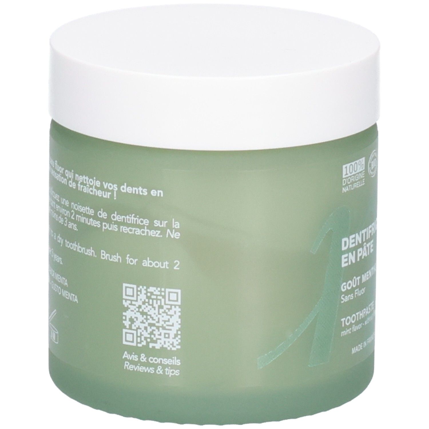 Vasetto in vetro verde con coperchio bianco, contiene dentifricio. Etichetta: "Dentifrice en pâte".