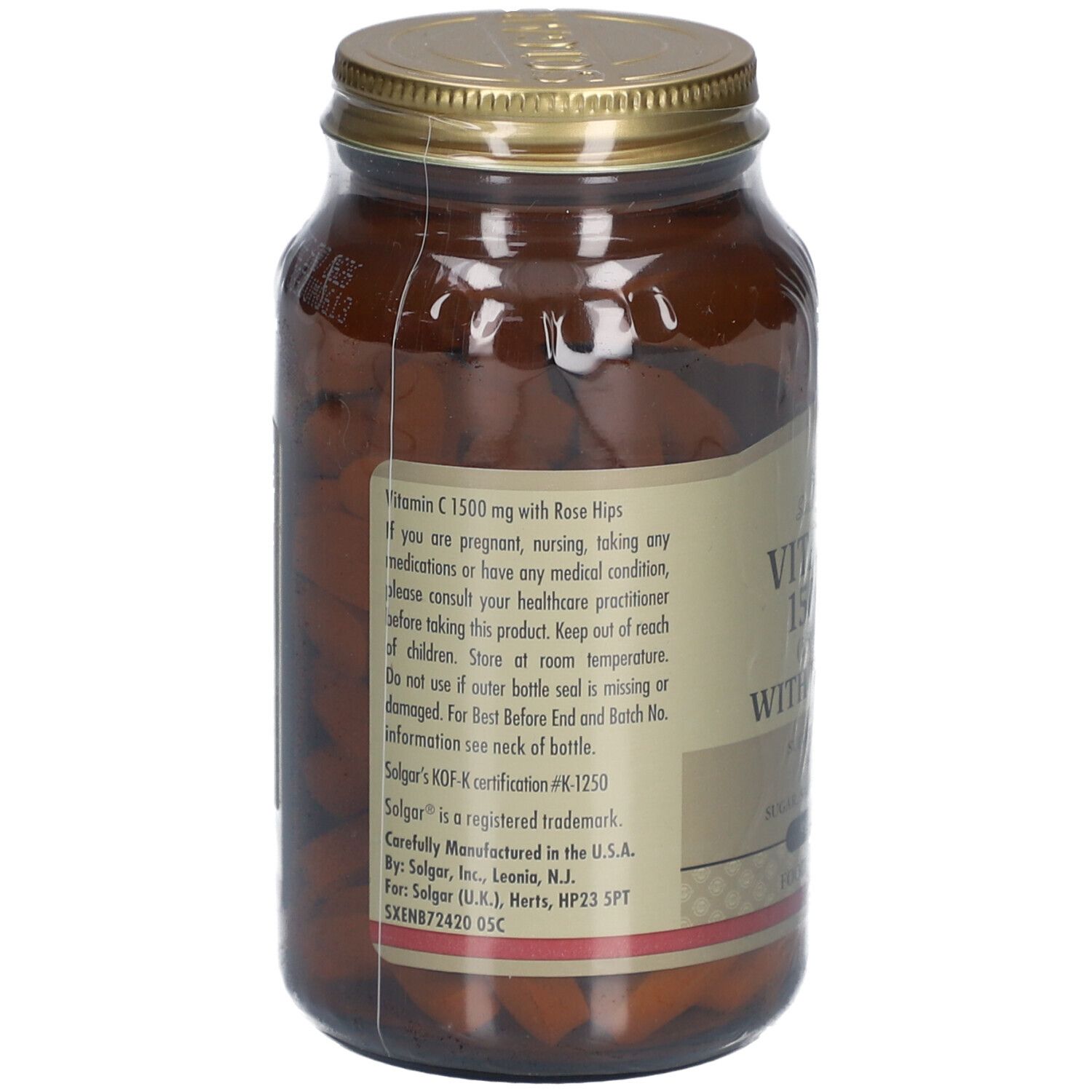 Retro del flacone di vetro marrone. Etichetta con informazioni sul prodotto e avvertenze. Contenuto: compresse.