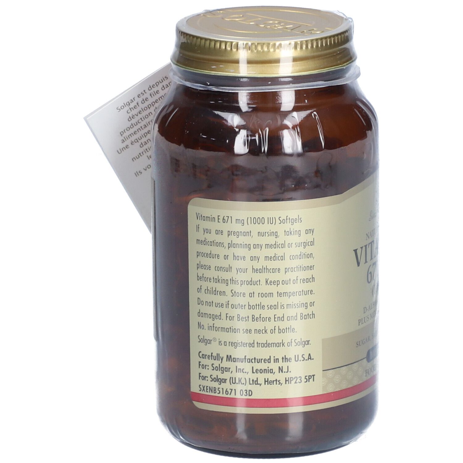 Flacone di vetro marrone con coperchio dorato. Retro con testo. Cartellino con testo e logo.