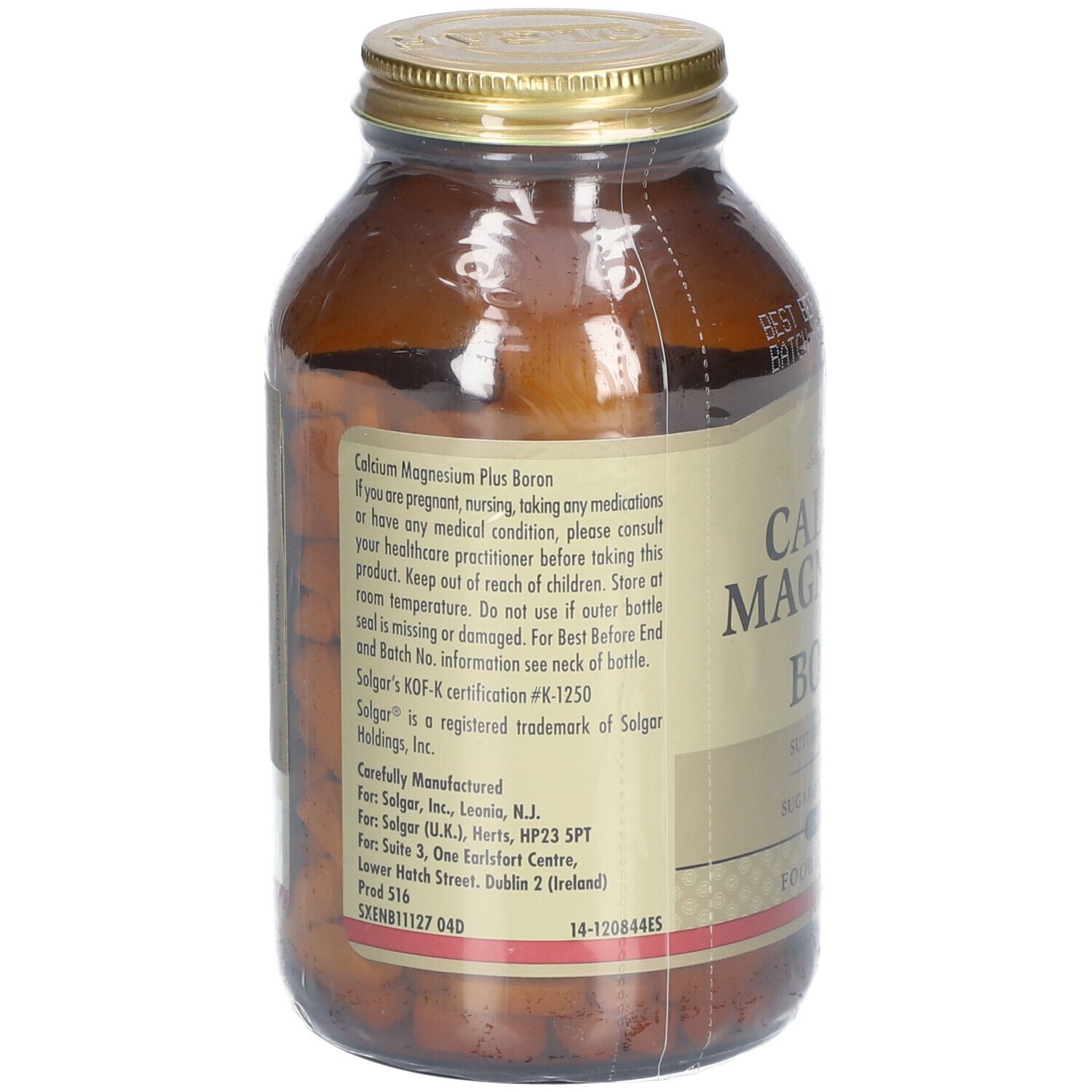 Retro di una bottiglia di vetro marrone. Etichetta con informazioni sul prodotto e dettagli del produttore. Contiene Calcium Magnesium Plus Boron.