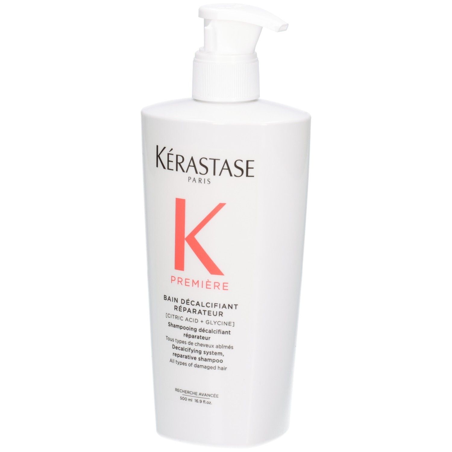 Flacone bianco Kérastase Bain Décalcifiant Réparateur shampoo con erogatore a pompa.