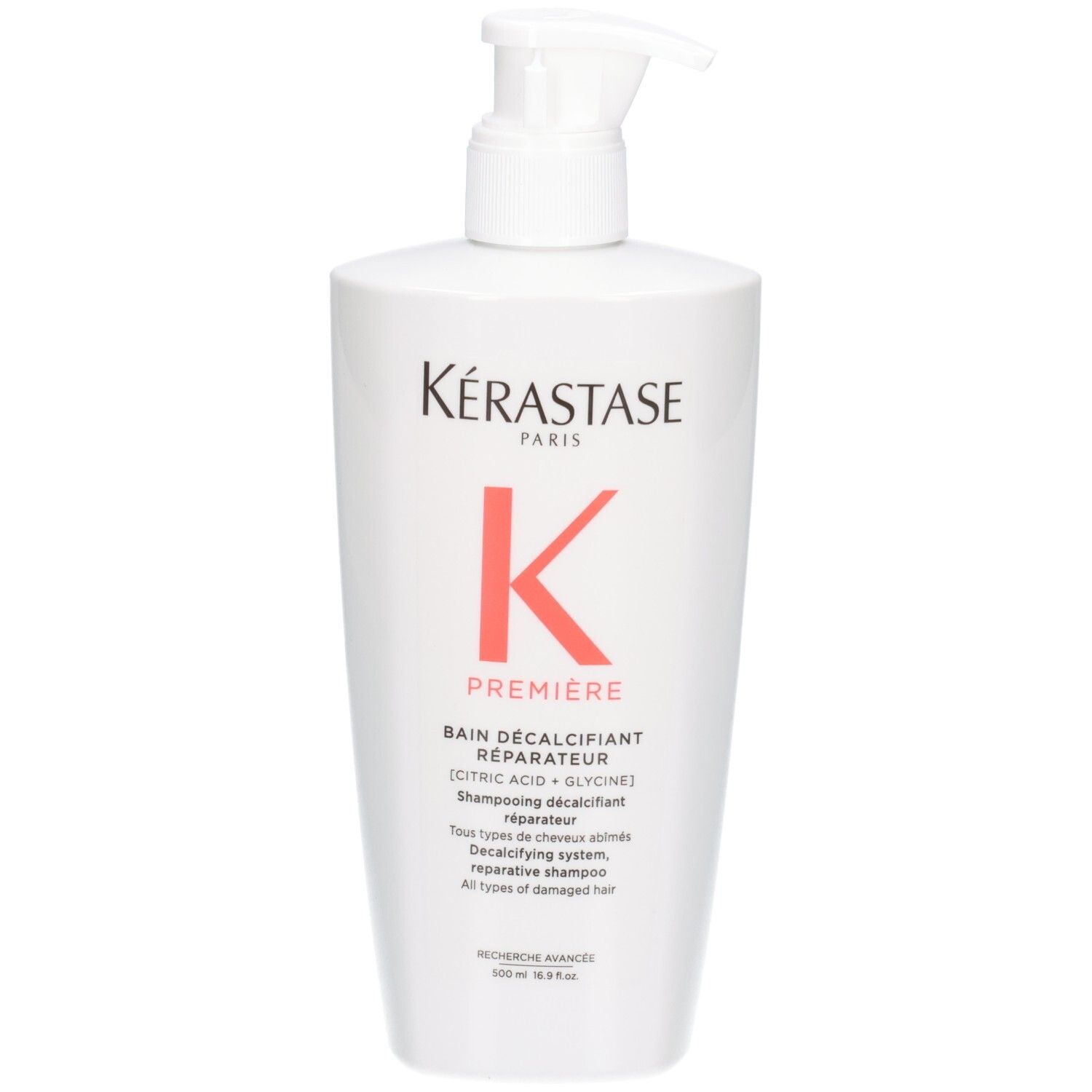 Flacone bianco Kérastase Bain Décalcifiant Réparateur shampoo con erogatore a pompa.
