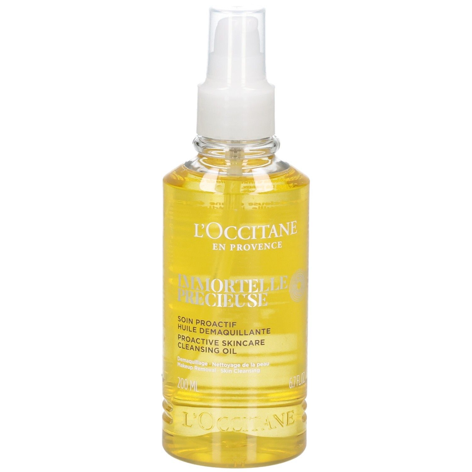 Olio detergente L'OCCITANE Immortelle in flacone spray trasparente con olio giallo.