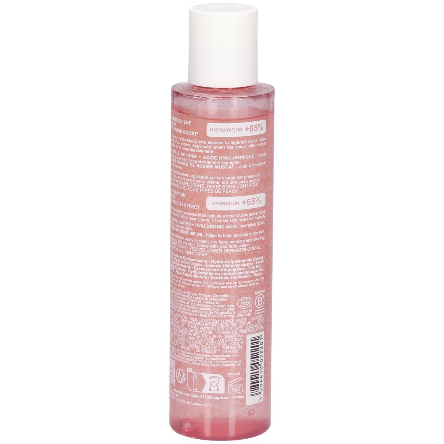 Vista posteriore del flacone di essenza di rosa. Informazioni testuali sull'etichetta. Flacone trasparente con liquido rosa e tappo bianco.