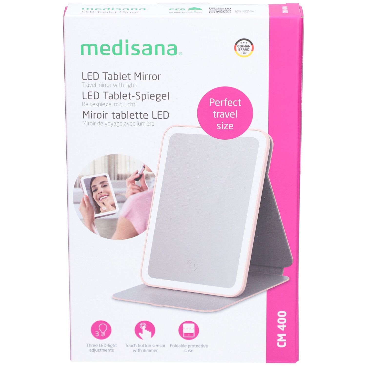 Confezione di LED Tablet Mirror. Marchio: medisana. Scatola rosa e bianca con immagine e testo. Perfect travel size.