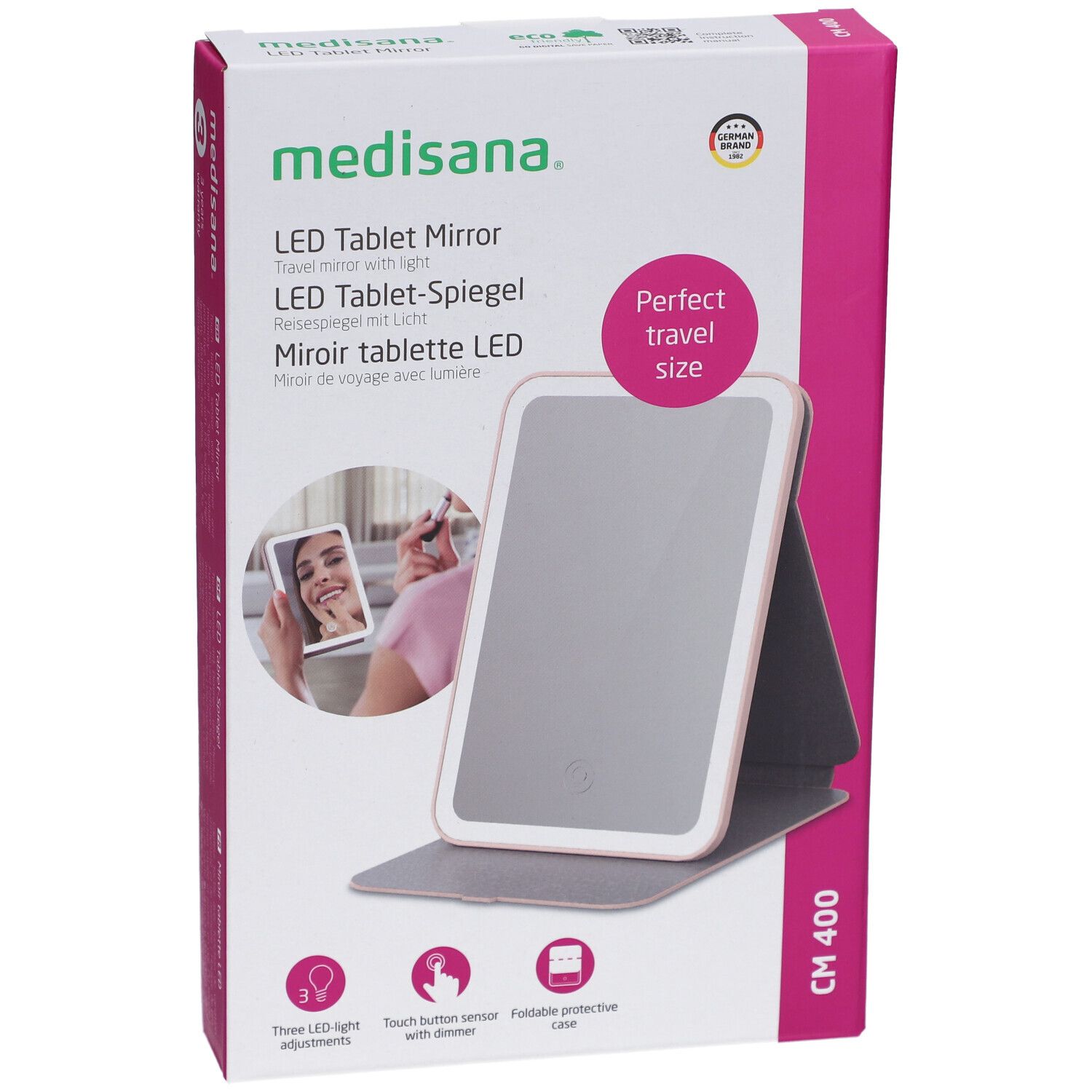 Confezione di LED Tablet Mirror. Marchio: medisana. Scatola rosa e bianca con immagine e testo. Perfect travel size.