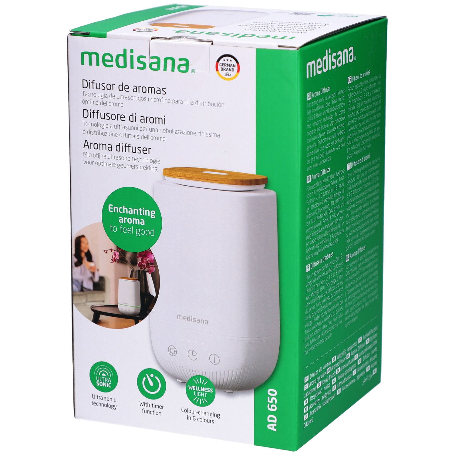 Diffusore di aromi in confezione. Bianco, coperchio in legno, confezione verde. Marchio: medisana. Nome: AD 650.