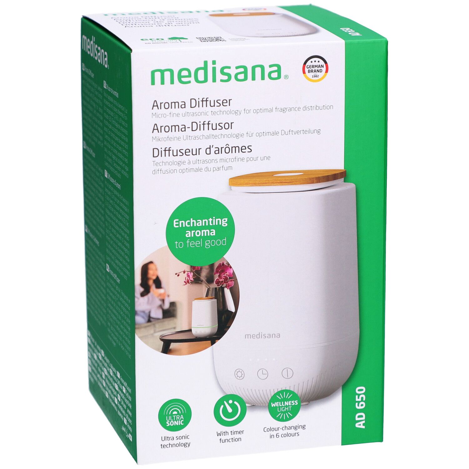 Diffusore di aromi in confezione. Bianco, coperchio in legno, confezione verde. Marchio: medisana. Nome: AD 650.