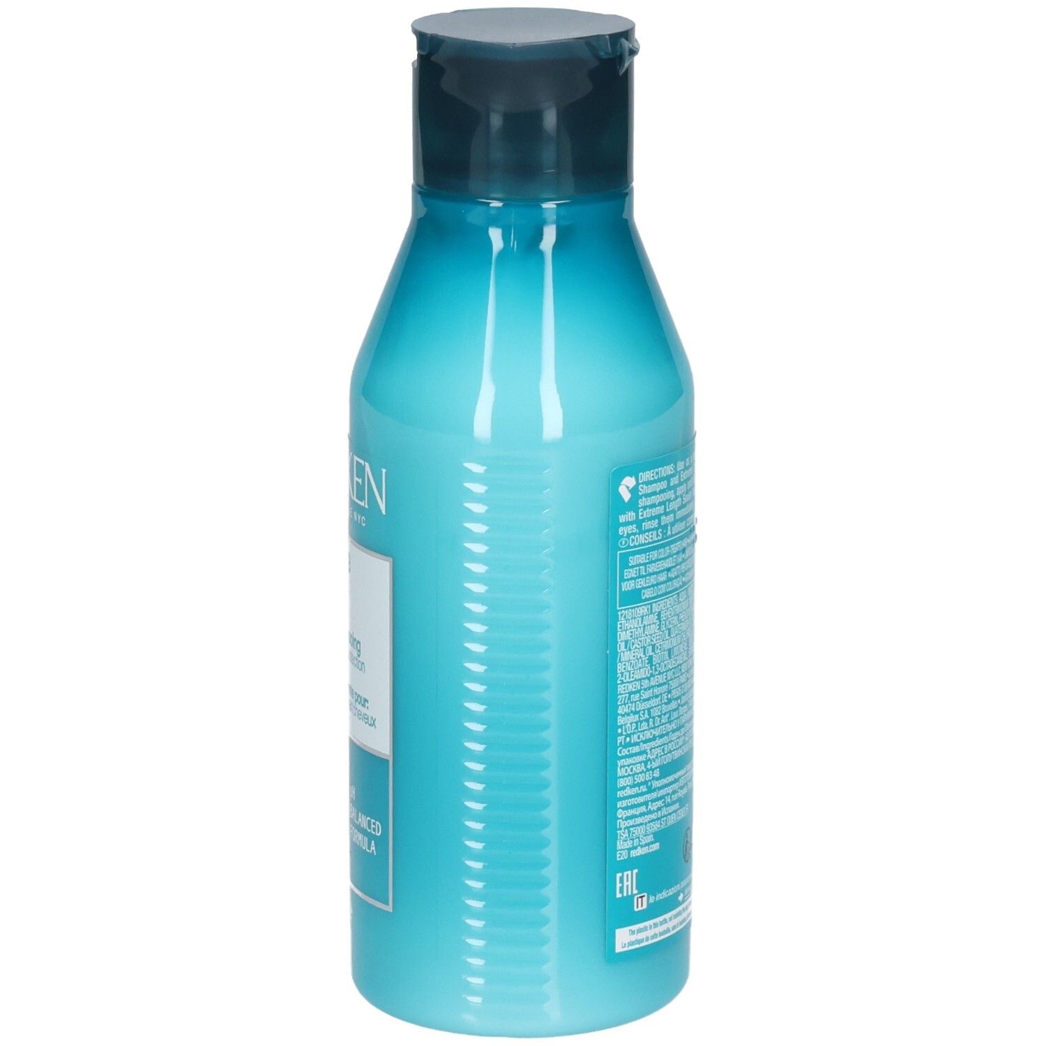 Lato di un flacone turchese con tappo blu scuro. Informazioni testuali. Contiene REDKEN Extreme Length Conditioner.