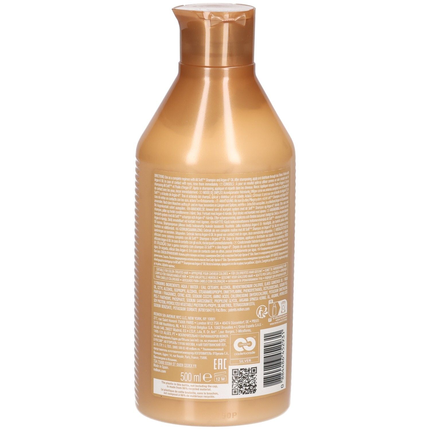 Retro di un flacone di balsamo dorato. Testo sull'etichetta.