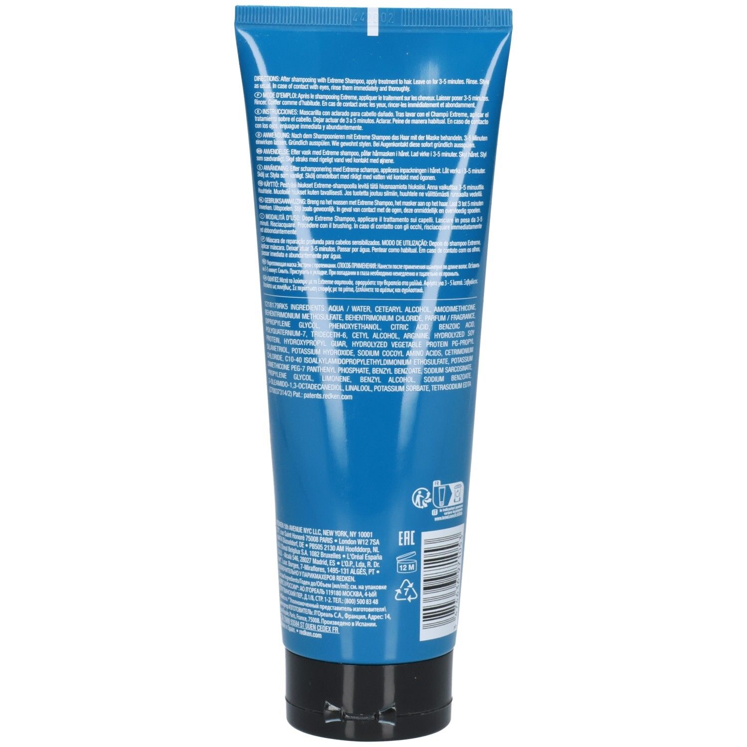 Retro di un tubo blu con tappo nero. Testo multilingue. Codice EAN e simboli di riciclaggio.