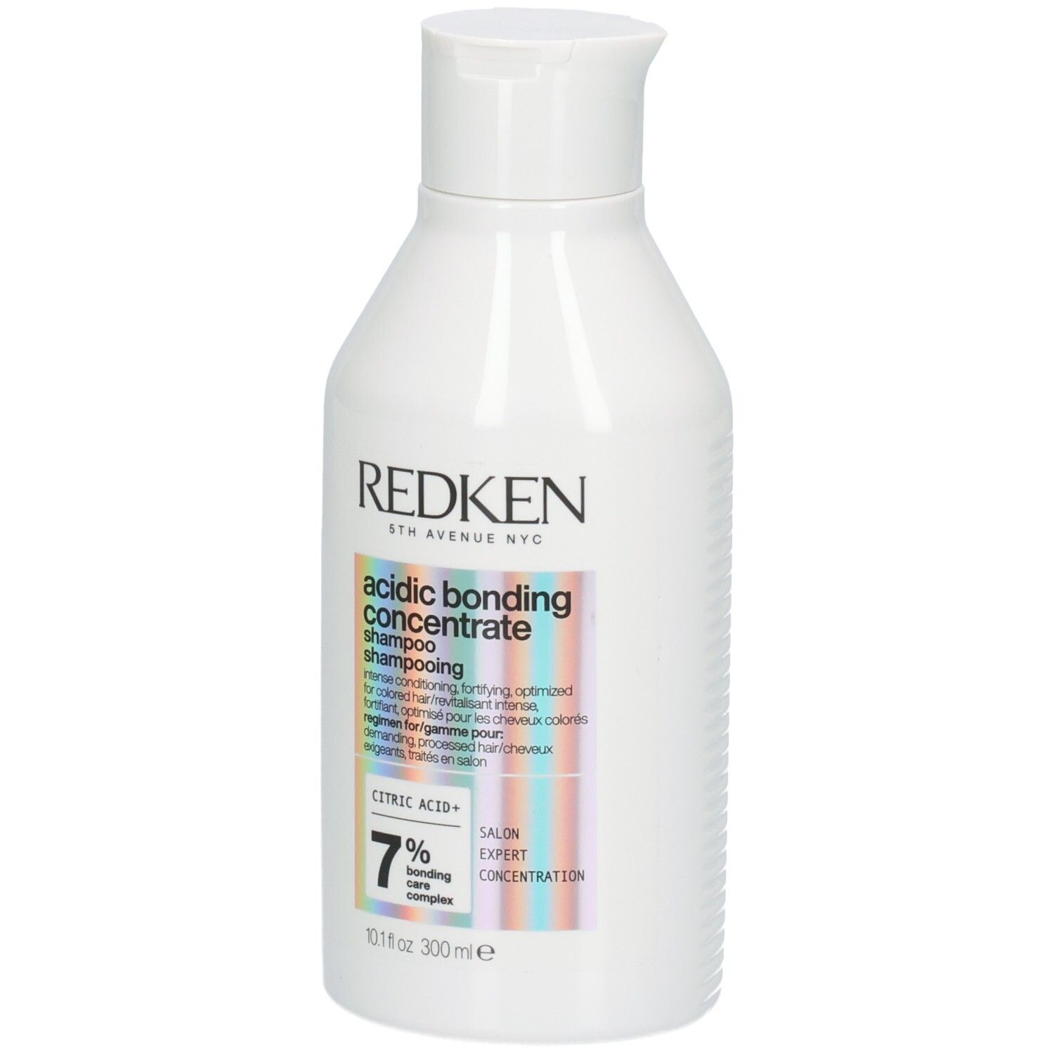 Flacone di shampoo bianco. Etichetta con nome del prodotto e ingredienti. Marca: Redken. 300ml.