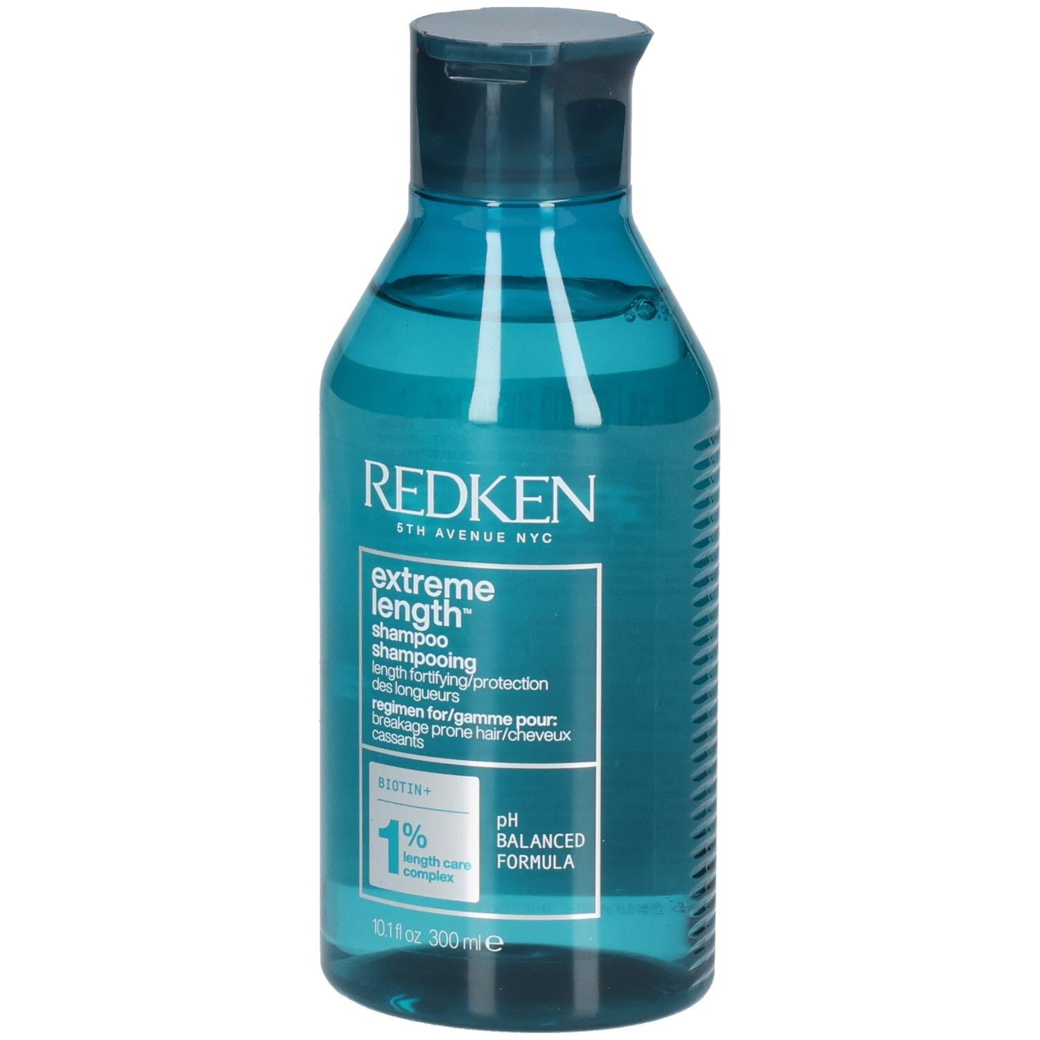 Flacone di shampoo blu trasparente. Scritta: Redken, Extreme Length Shampoo. Contiene biotina. Formula pH bilanciata.