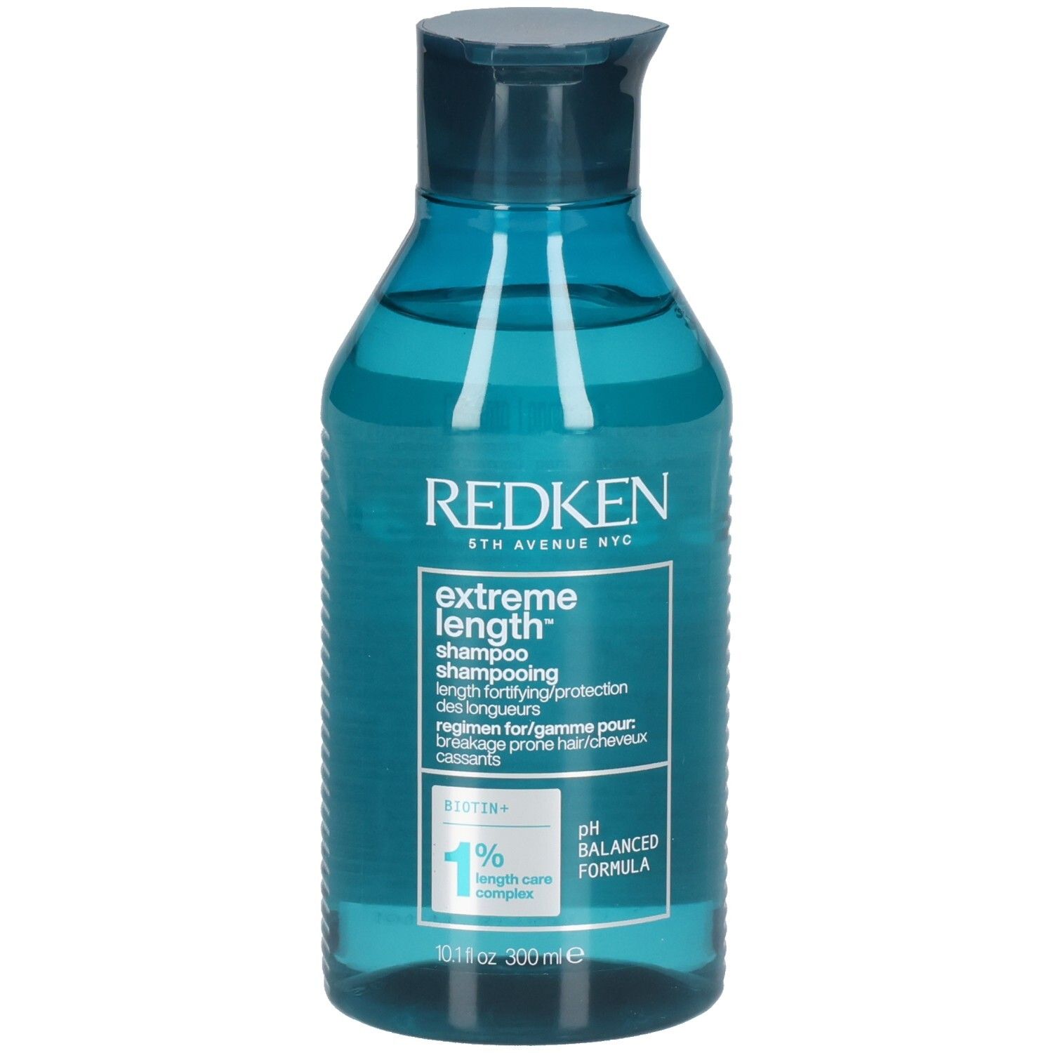 Flacone di shampoo blu trasparente. Scritta: Redken, Extreme Length Shampoo. Contiene biotina. Formula pH bilanciata.