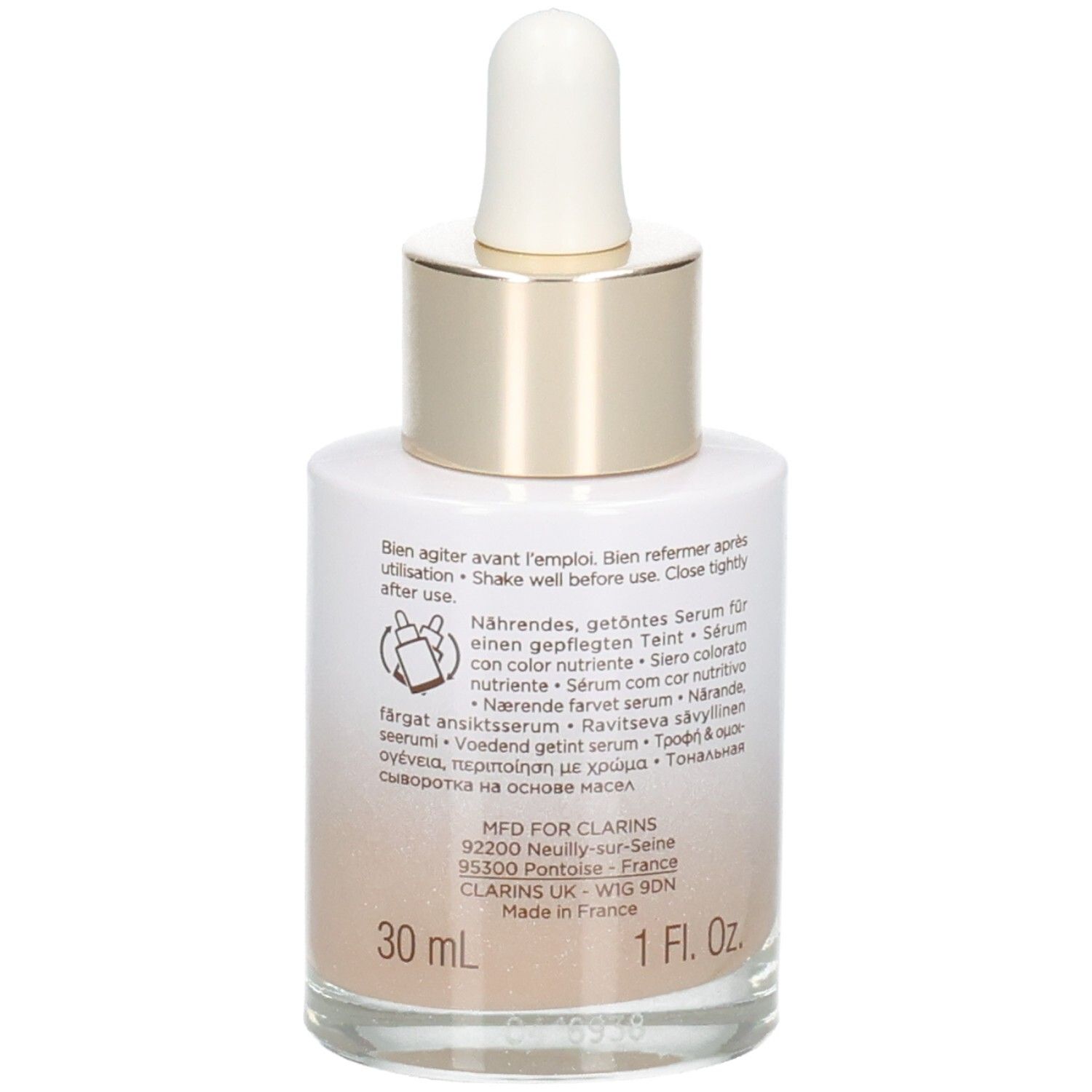 Clarins Tinted Oleo-Serum 04: flacone in vetro con contagocce, 30 ml. Retro con istruzioni e dettagli di produzione.