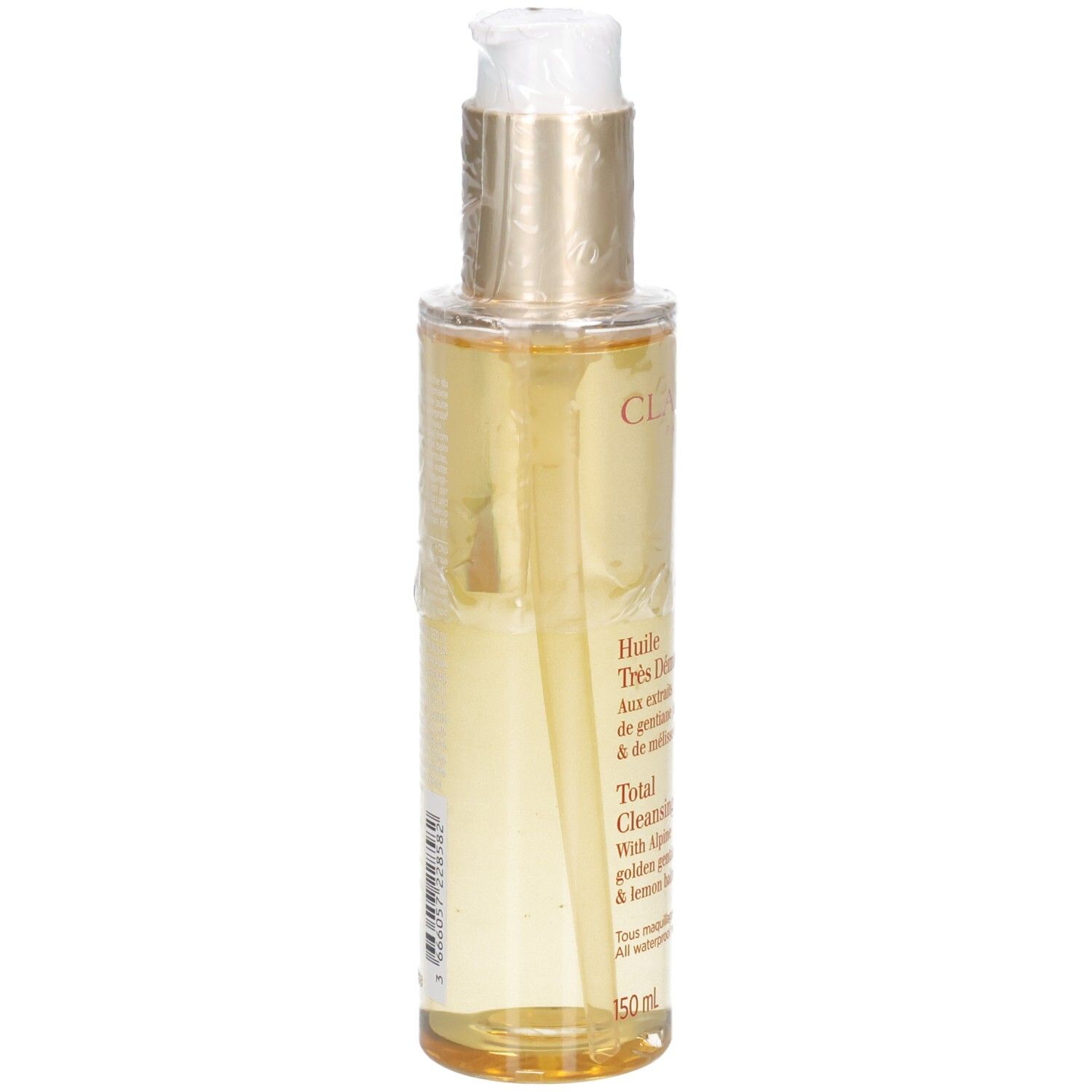 Clarins Total Cleansing Oil: liquido dorato in flacone con erogatore, vista laterale.