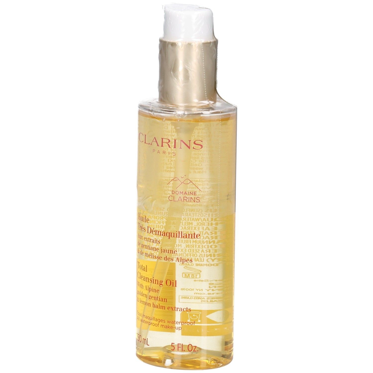 Clarins Total Cleansing Oil: liquido dorato in flacone con erogatore e etichetta.