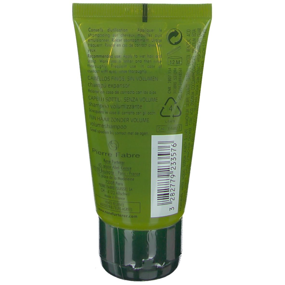 Retro del tubo verde. Testo multilingue. Tappo nero. Informazioni del produttore.