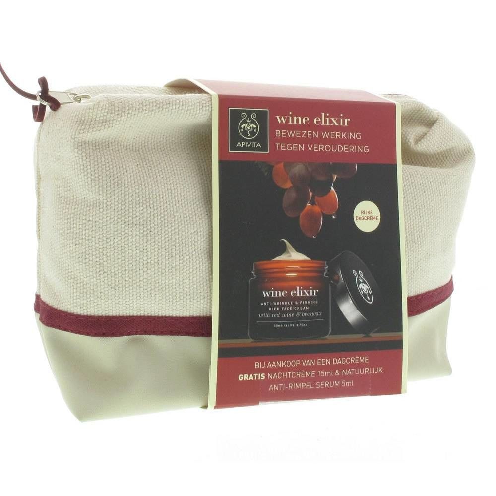 Borsa cosmetica beige con striscia rossa. Confezione prodotto con scritta 'wine elixir' e immagine di uva.