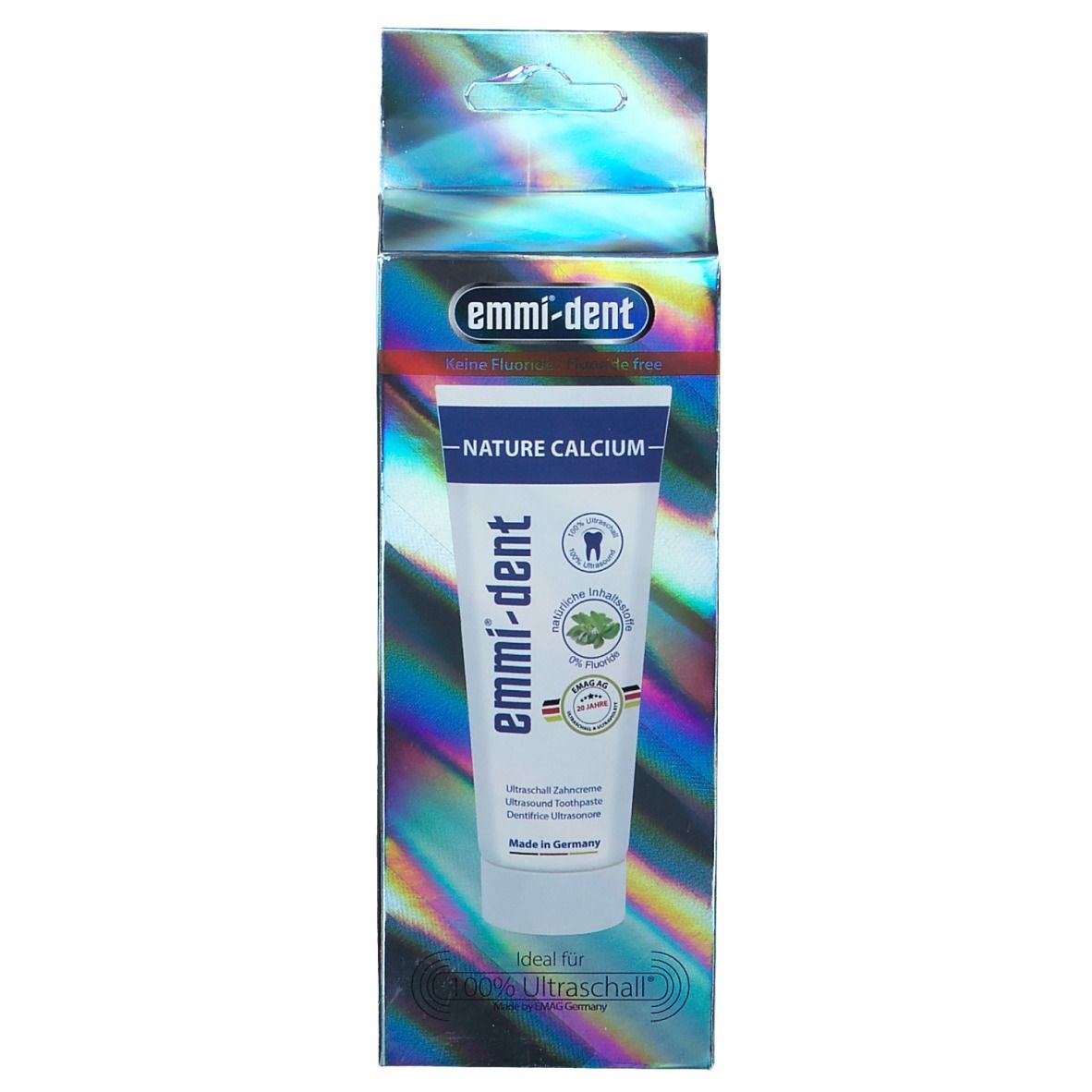 Confezione del dentifricio. Blu-argento. Scritte: emmi-dent, Nature Calcium, 0% Fluoro. Con sigilli e 'Made in Germany'.