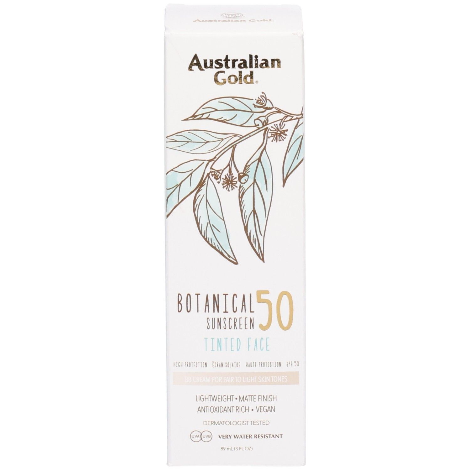 Scatola di crema solare colorata per viso SPF 50 con foglie botaniche.