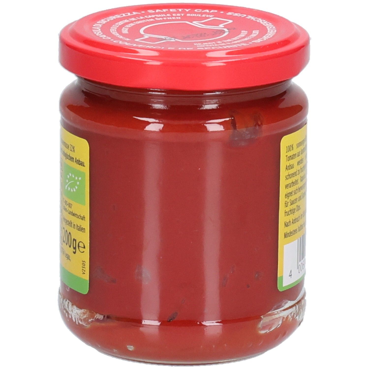 Vasetto di concentrato di pomodoro, retro. Coperchio rosso. Etichetta con testo, marchio bio e bandiera italiana.