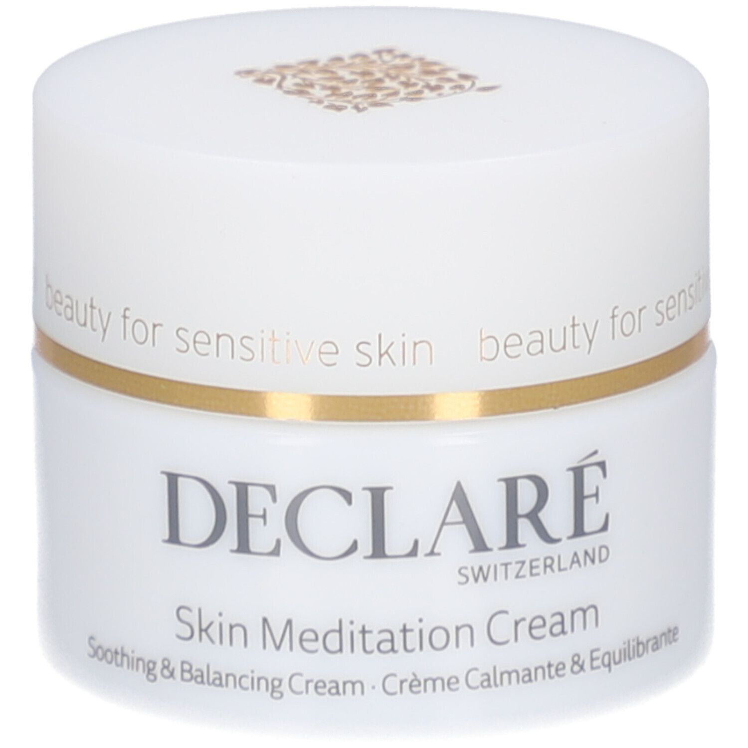 Vasetto di crema bianco con bordo dorato. Scritta: DECLARÉ SWITZERLAND, Skin Meditation Cream. Crema lenitiva e riequilibrante.