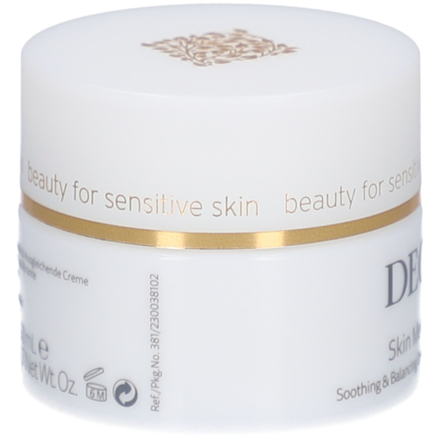 Vasetto di crema bianco con bordo dorato. Scritta: DECLARÉ SWITZERLAND, Skin Meditation Cream. Testo sul lato.