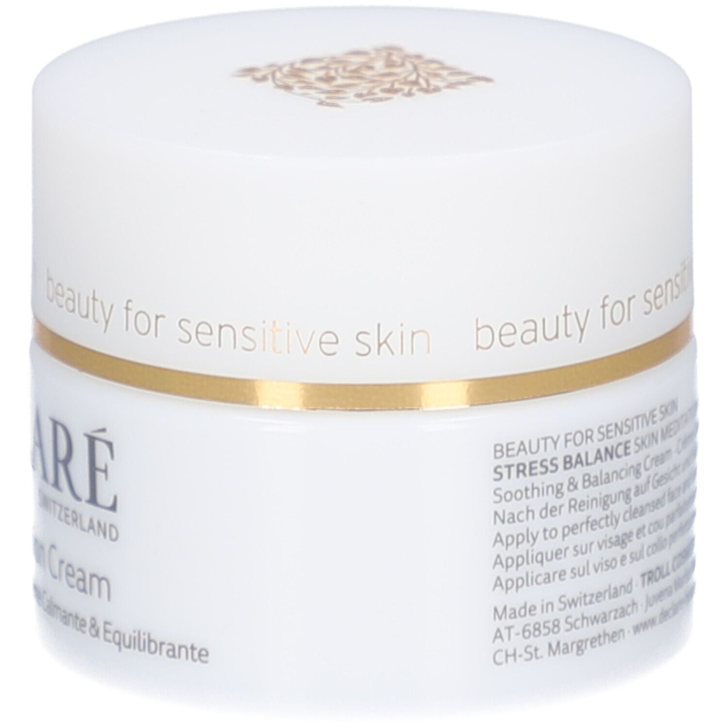 Vasetto di crema bianco con bordo dorato. Scritta: DECLARÉ SWITZERLAND, Skin Meditation Cream. Testo sul lato.