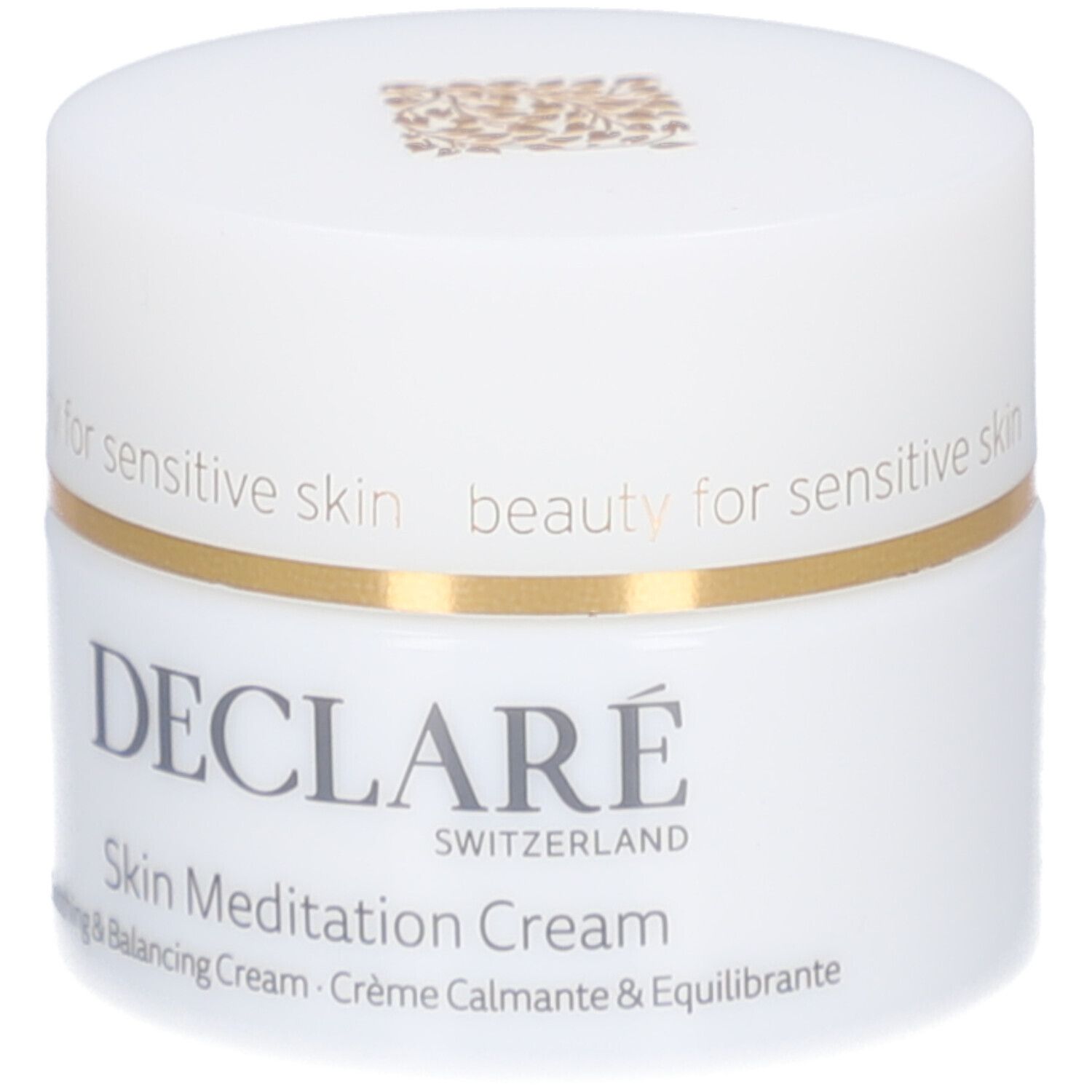 Vasetto di crema bianco con bordo dorato. Scritta: DECLARÉ SWITZERLAND, Skin Meditation Cream. Crema lenitiva e riequilibrante.