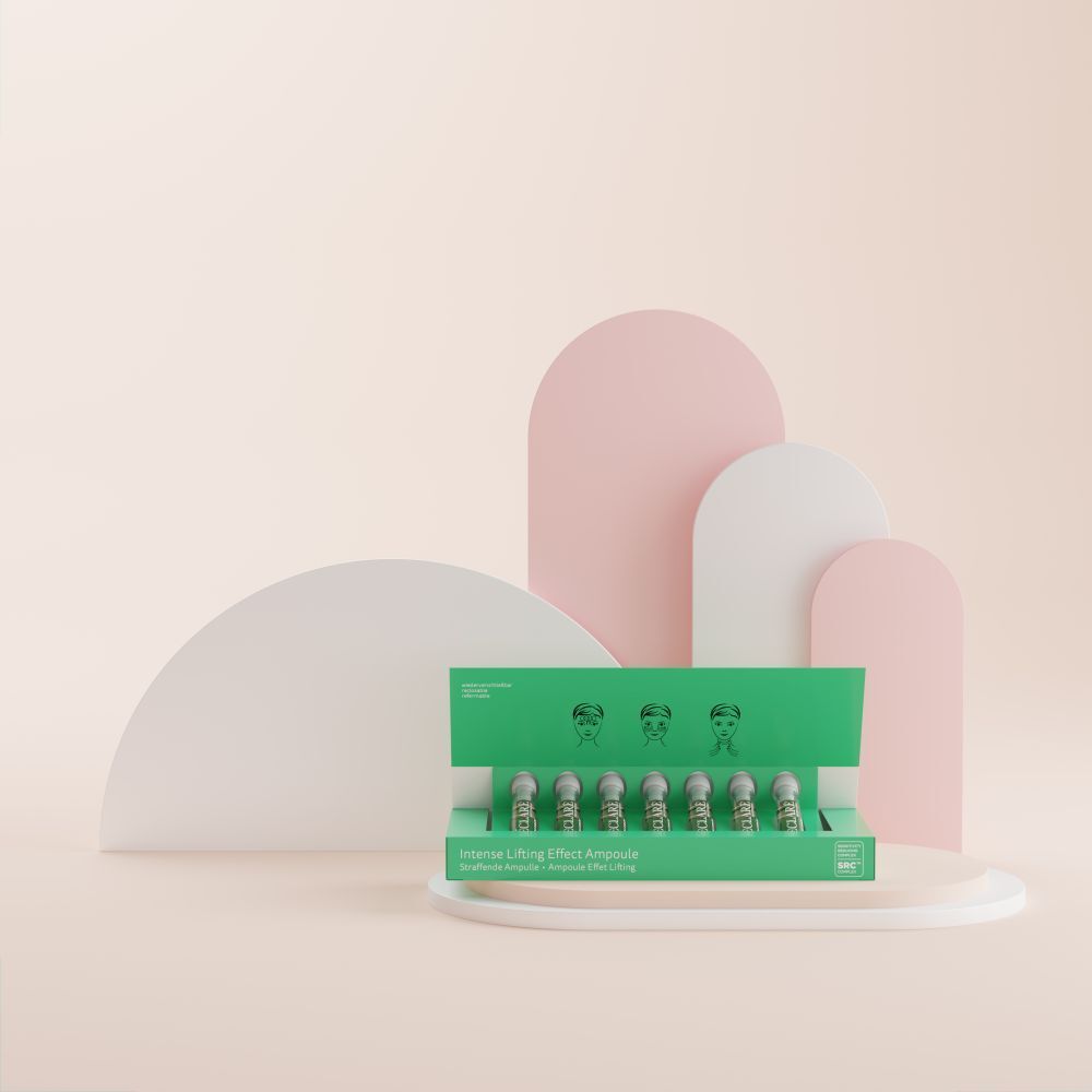 Scatola verde con ampoule. Scritta: Intense Lifting Effect Ampoule. Su sfondo rosa e bianco.