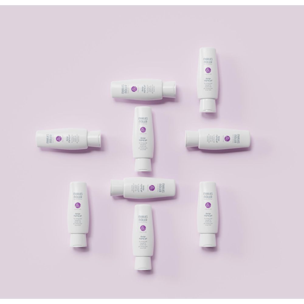 Diversi tubi di gel per lo styling Design bianchi su sfondo viola. Marchio Marlies Möller.