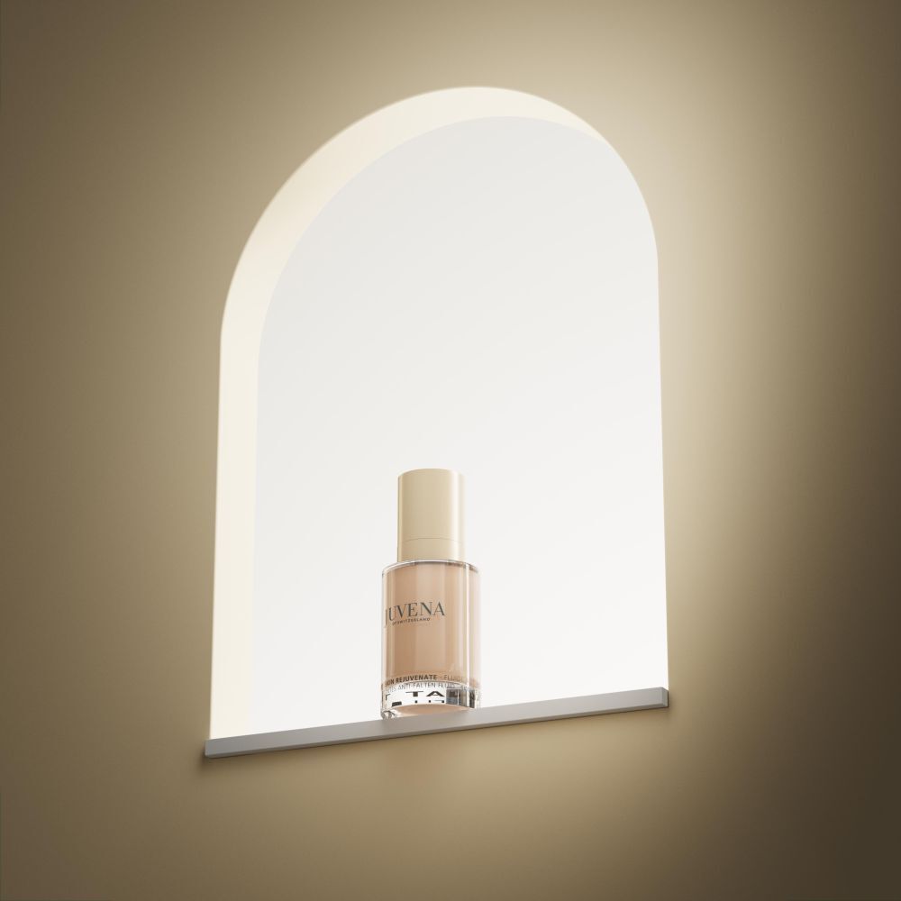 Fluido colorato Juvena of Switzerland. Flacone in una nicchia. Flacone beige, tappo dorato.