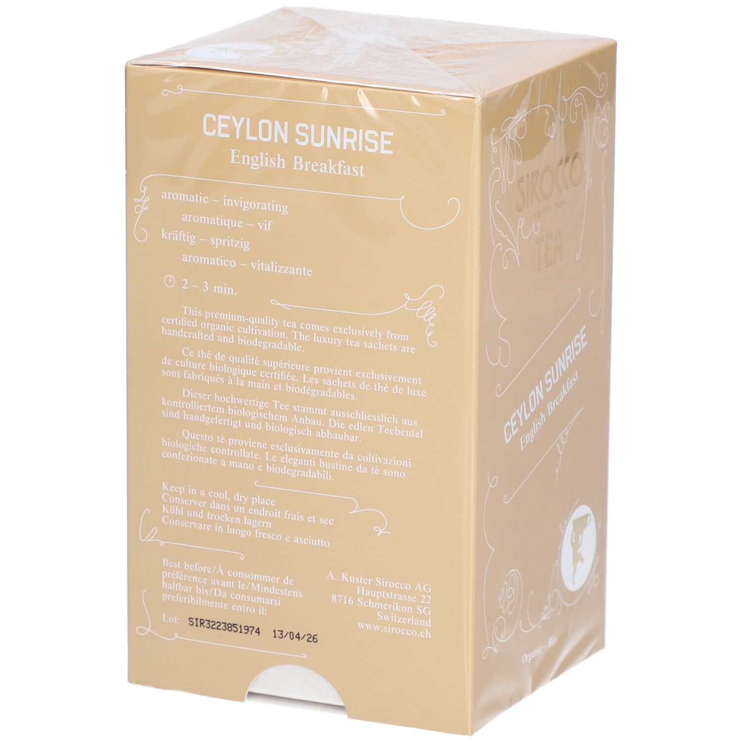 Lato della confezione di tè. Scritta: Ceylon Sunrise English Breakfast. Contiene informazioni sulla preparazione e la conservazione.