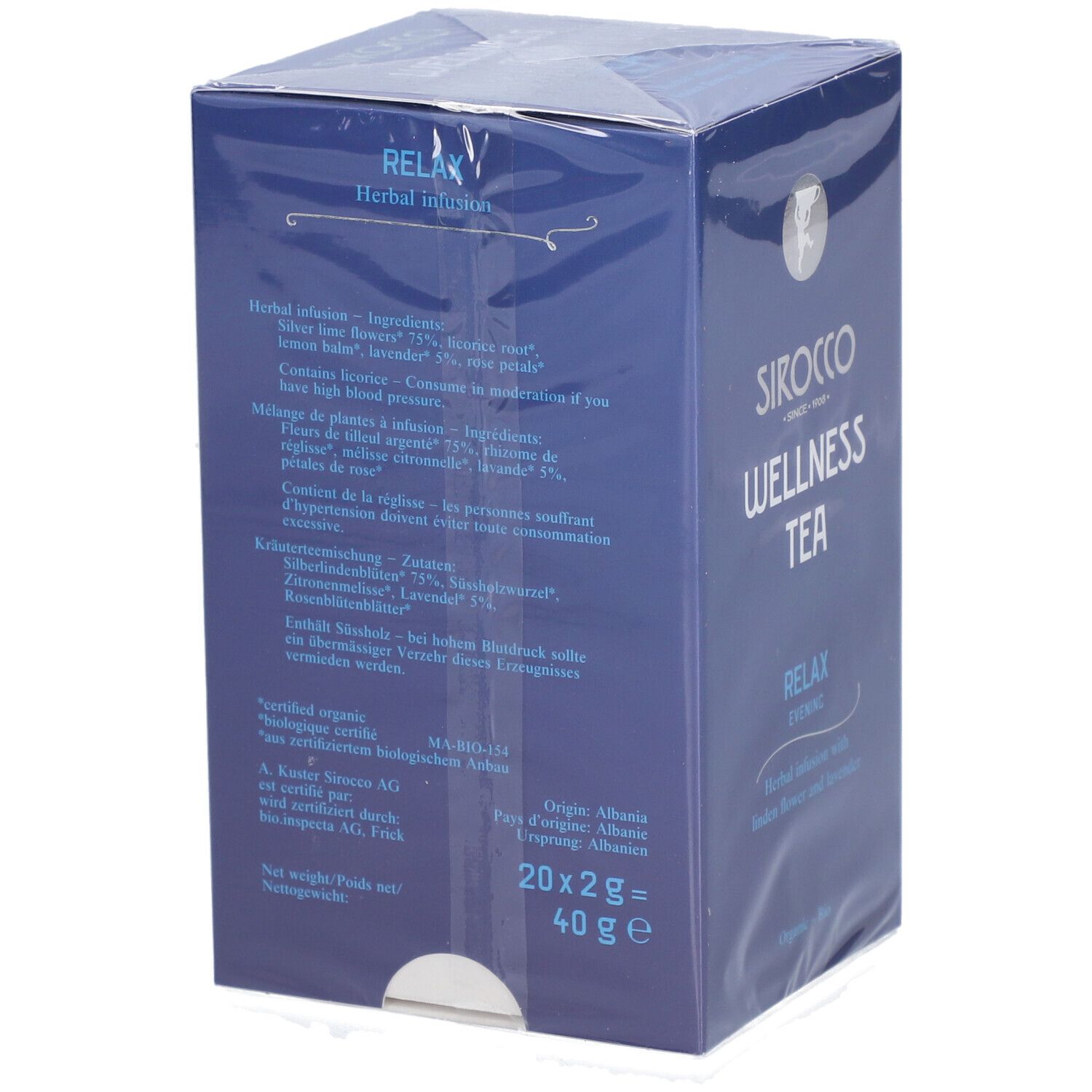 Retro della scatola blu. Testo sugli ingredienti, le istruzioni e l'origine. "Sirocco Wellness Tea" e "Relax Evening" visibili.