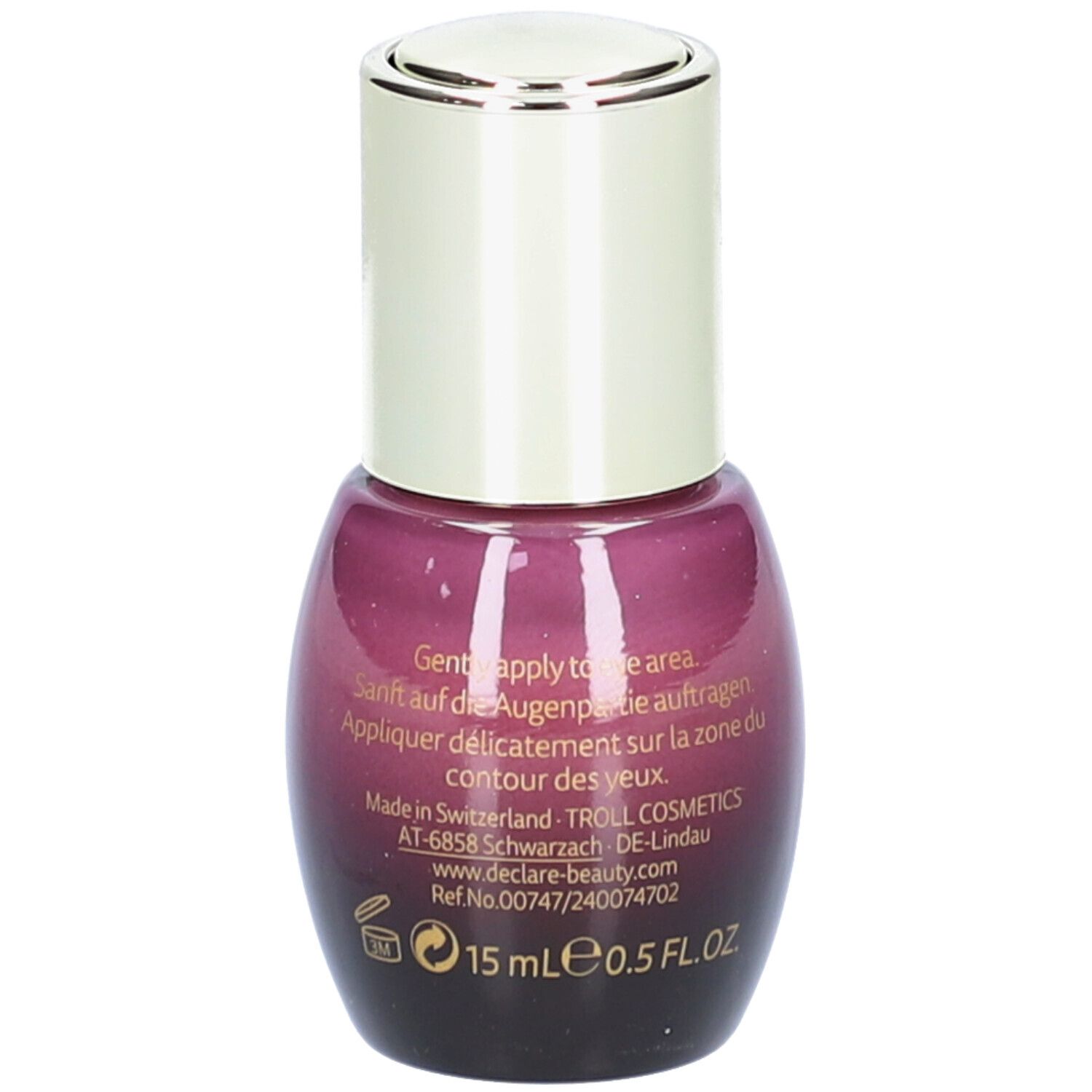 Retro del flacone viola con tappo argentato. Testo in più lingue, 15 ml.