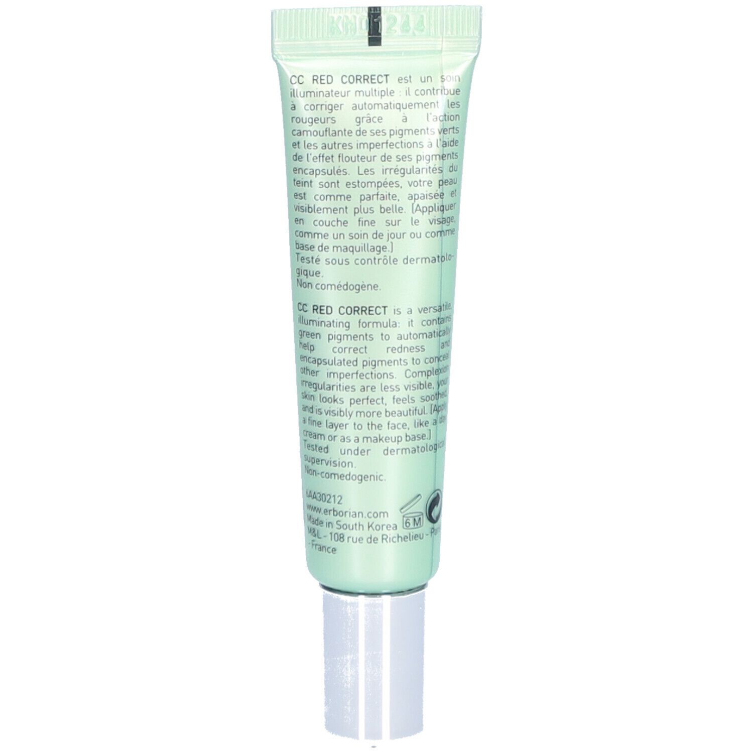 Retro del tubo verde. Testo in più lingue. Contiene informazioni sul prodotto e sul produttore.