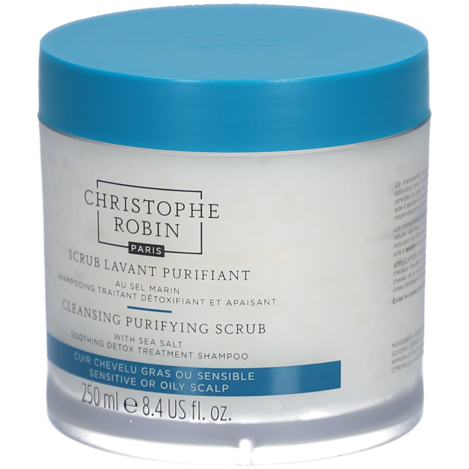 Barattolo rotondo con coperchio blu. Scritta: CHRISTOPHE ROBIN PARIS, SCRUB LAVANT PURIFIANT, CLEANSING PURIFYING SCRUB, 250 ml.