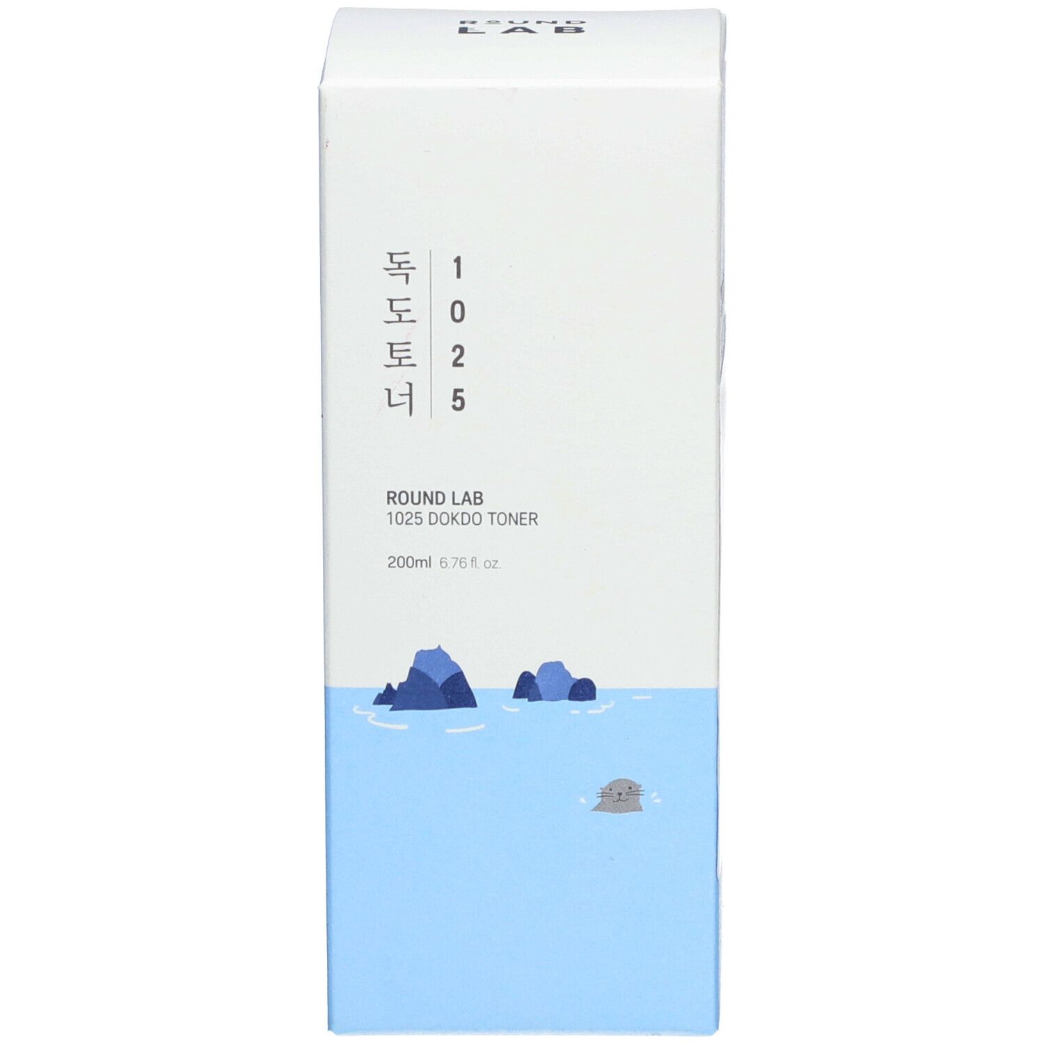 Confezione prodotto blu con testo bianco e coreano. Illustrazione di rocce e mare.