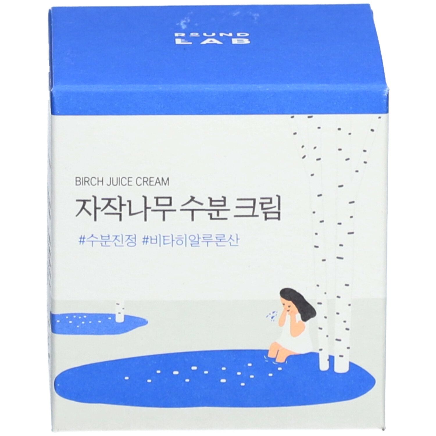 Scatola blu con testo bianco e illustrazione. Birch Juice Cream. Testo coreano.