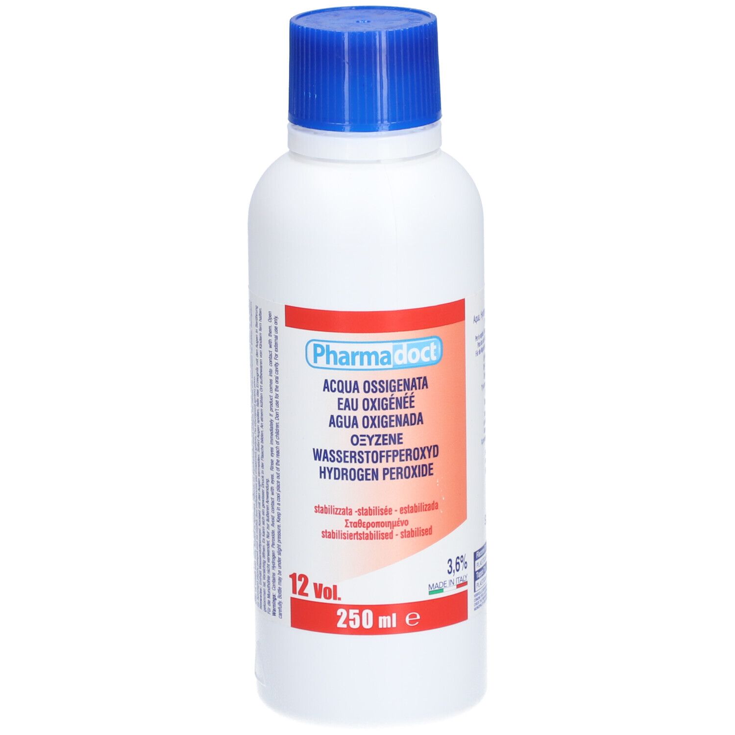 Flacone bianco con tappo blu. Etichetta rossa con nome del prodotto e indicazioni multilingue. 250 ml.