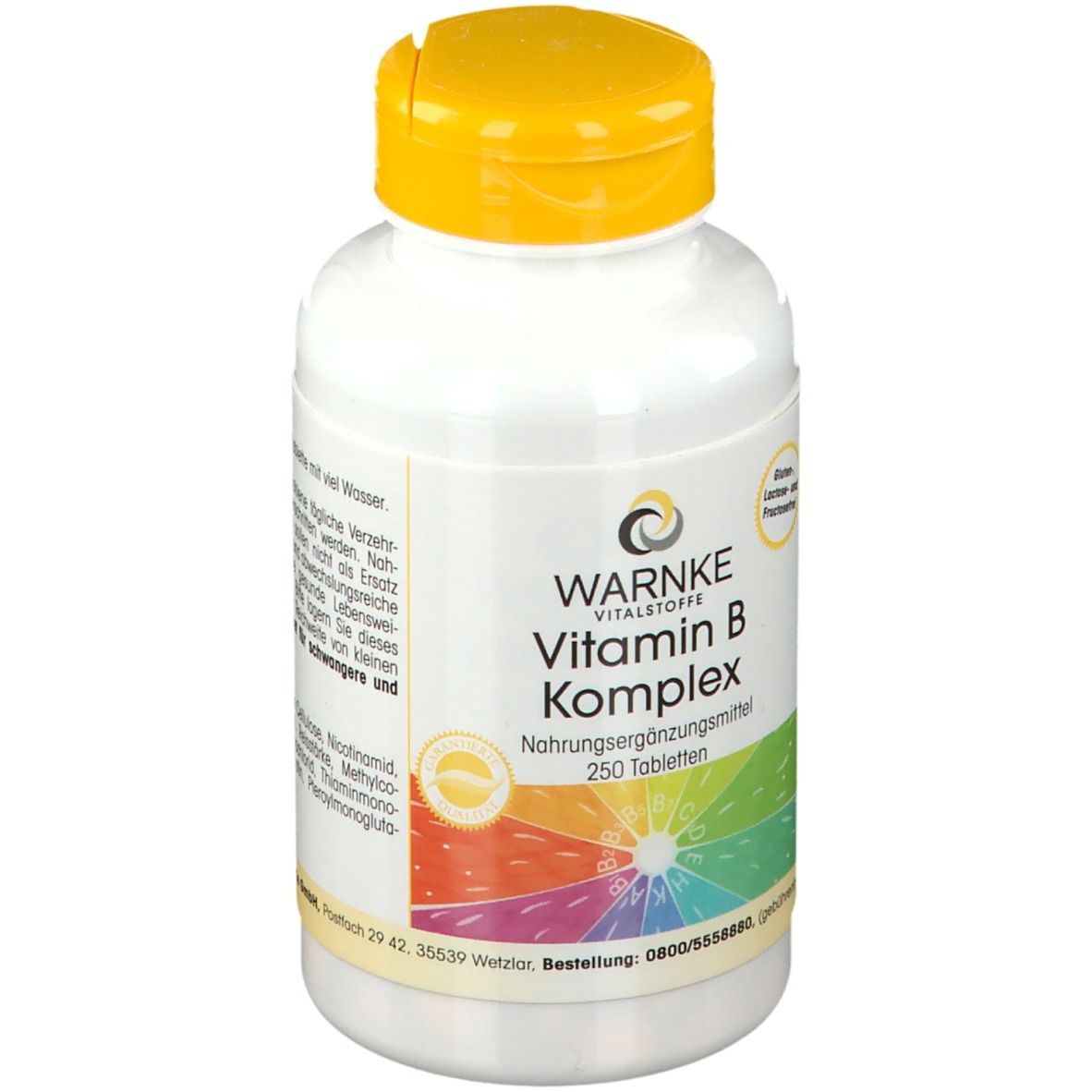 Flacone bianco con tappo giallo. Scritta: WARNKE Vitamin B Komplex, 250 compresse. Arcobaleno colorato.