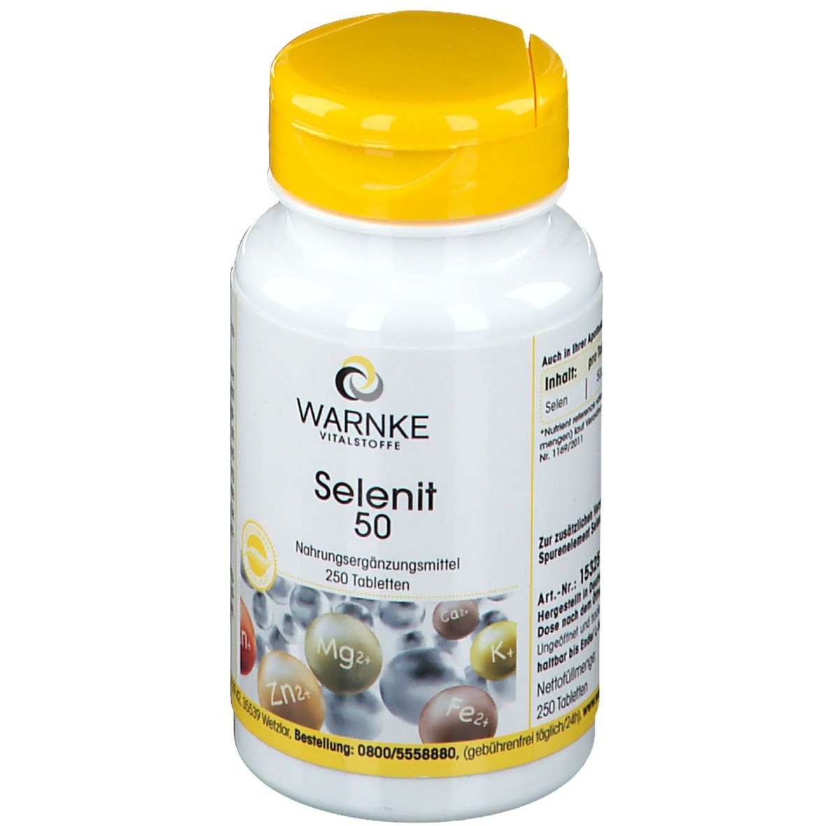 Flacone bianco con tappo giallo. Scritta: WARNKE Selenit 50. 250 compresse. Integratore alimentare. Illustrazione di minerali.