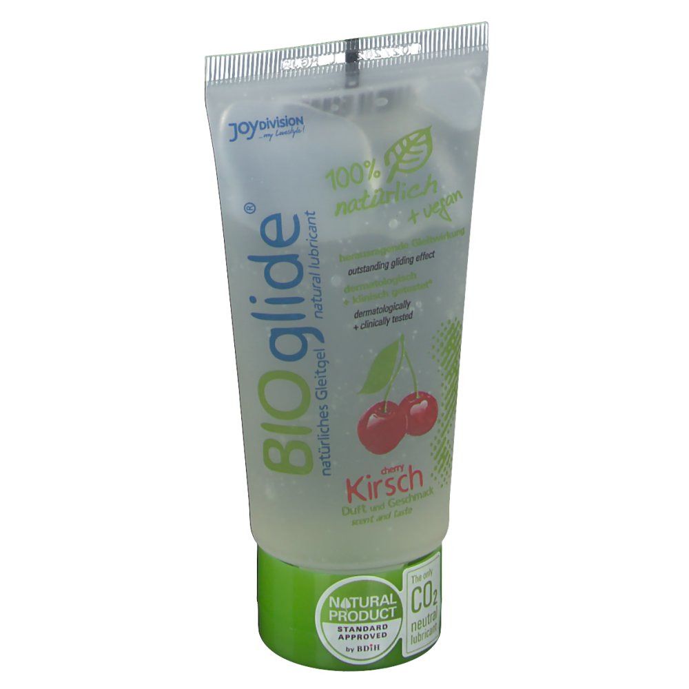 Tubo trasparente con tappo verde. Scritta BIOglide Kirsche, 100% naturale + vegano. Immagine di ciliegie.
