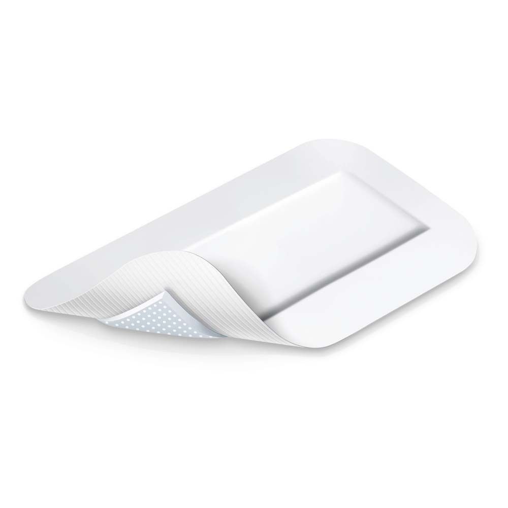Medicazione aperta. Forma rettangolare con angoli arrotondati. Colore bianco. Superficie adesiva visibile.