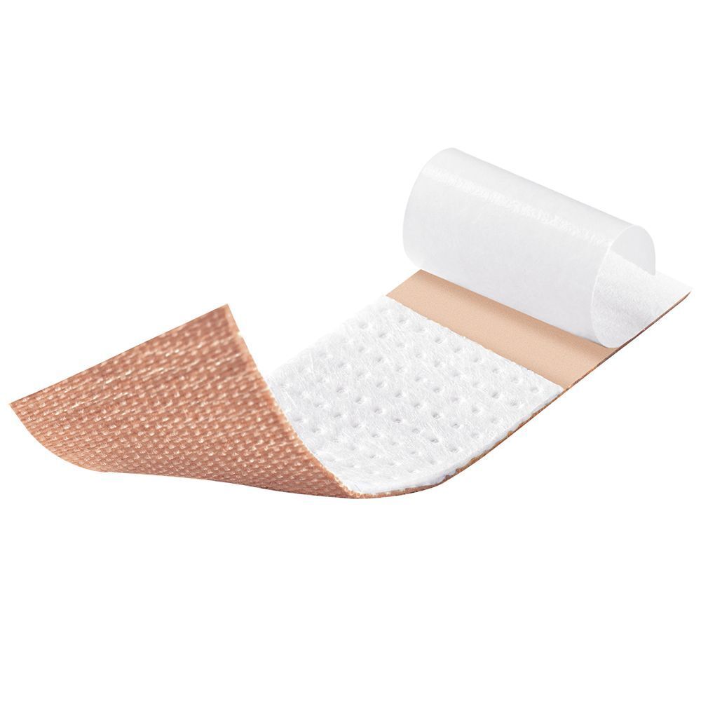 Un cerotto DermaPlast® classic parzialmente staccato, che mostra il tampone assorbente bianco.