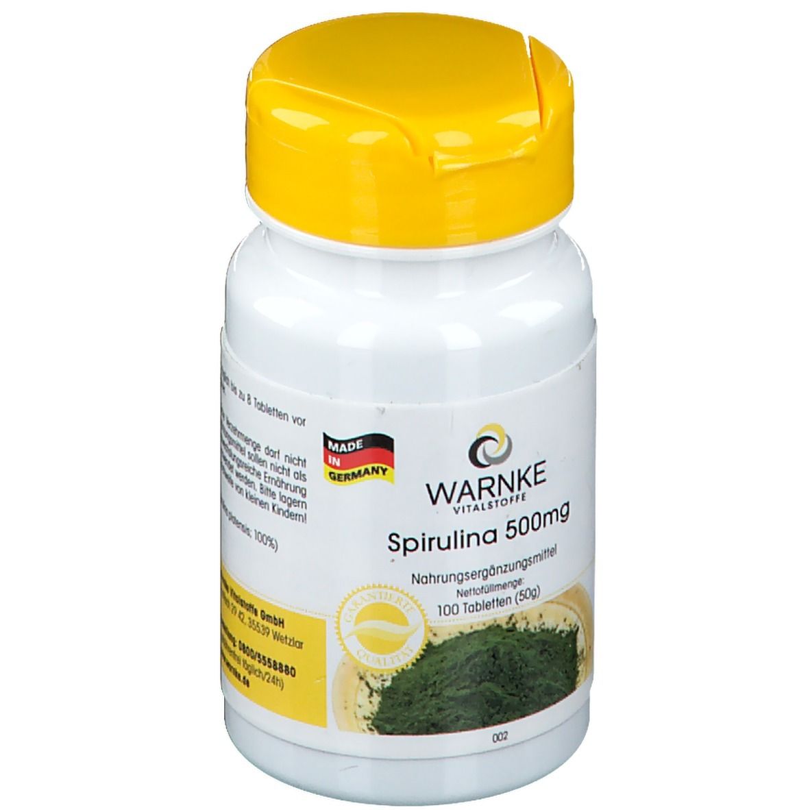 Flacone bianco con tappo giallo. Scritta: WARNKE Vitalstoffe Spirulina 500mg. 100 compresse. Prodotto in Germania.