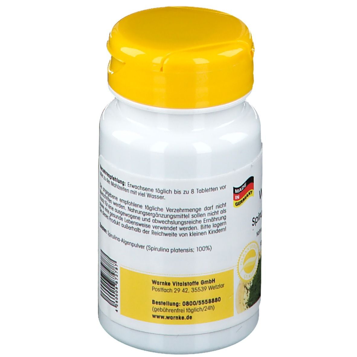 Retro del flacone bianco con tappo giallo. Testo in tedesco. Warnke Vitalstoffe, polvere di alghe spirulina. Prodotto in Germania.